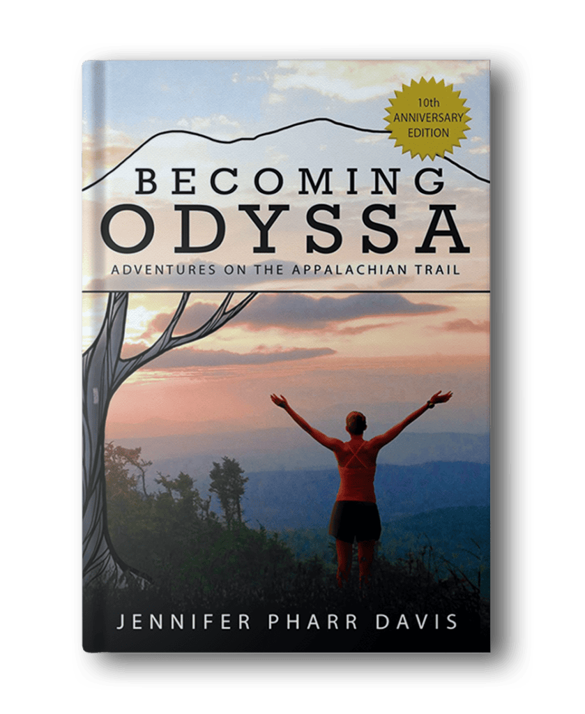 Book cover of "Becoming Odyssa: Adventures on the Appalachian Trail" by Jennifer Pharr Davis, a quintessential hiking book for women, features a woman with outstretched arms against a mountainous landscape backdrop. Includes 10th Anniversary Edition sticker.
