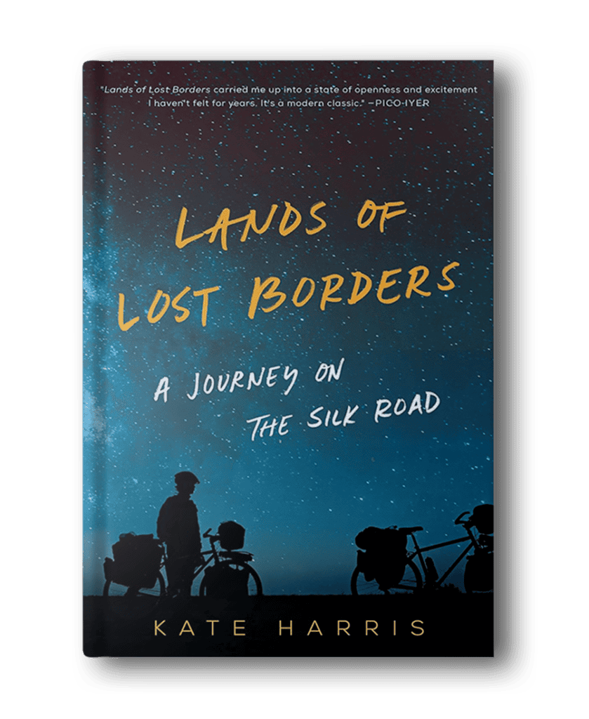 The cover of "Lands of Lost Borders: A Journey on the Silk Road" by Kate Harris, a standout among hiking books for women, features a silhouette of a person with a bike under a starry sky.