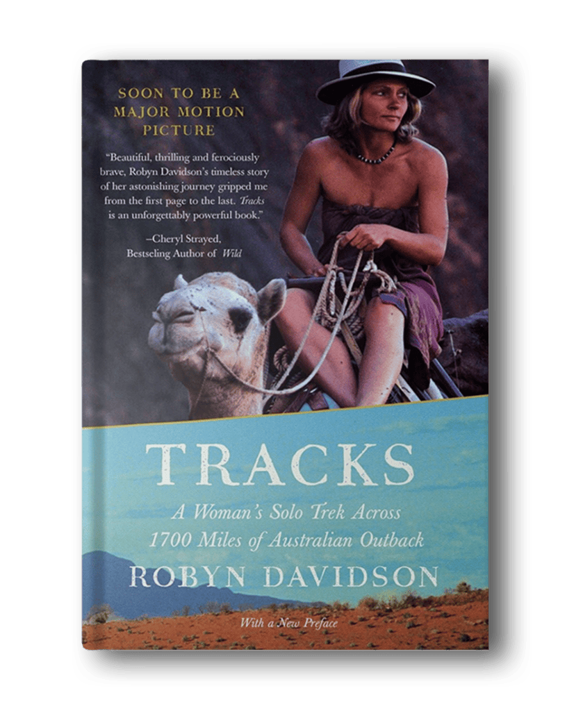 Cover of the book "Tracks: A Woman's Solo Trek Across 1700 Miles of Australian Outback" by Robyn Davidson. Featuring a woman sitting beside a camel in a desert landscape, this is an inspiring addition to hiking books for women.