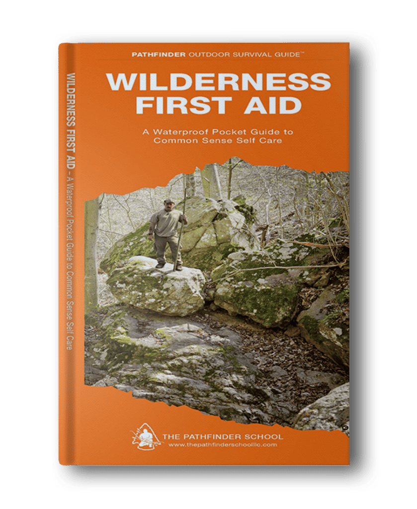 Book titled "Wilderness First Aid: A Waterproof Pocket Guide to Common Sense Self Care" by The Pathfinder School, featuring a cover image of a person navigating rocky terrain in the wilderness. Ideal for those seeking hiking books for women, this guide is essential for any adventurous spirit.