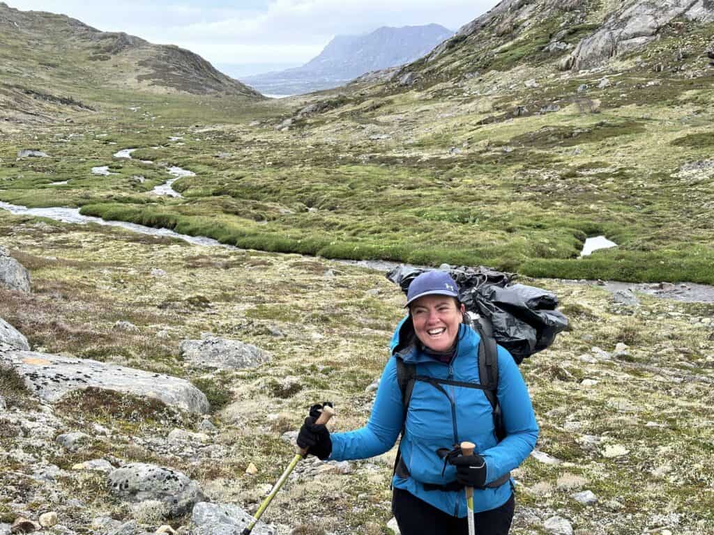 Belinda in a blue jacket, in the valley towards Sisimuit with Sisimuit in the background